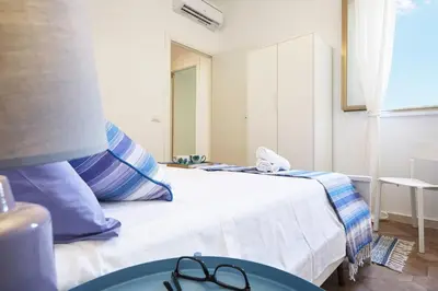 Letto o letti in una camera di Casa Vacanza Noban - CaseSicule