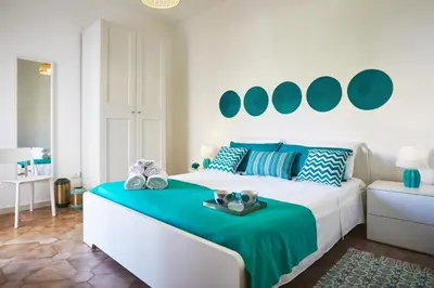 Letto o letti in una camera di Casa Vacanza Noban - CaseSicule