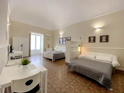Letto o letti in una camera di Duomo Rooms b&b