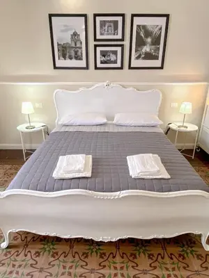 Letto o letti in una camera di Duomo Rooms b&b