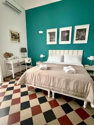 Letto o letti in una camera di Duomo Rooms b&b