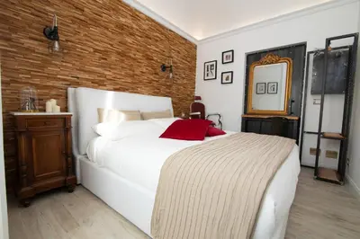 Letto o letti in una camera di La Dimora del Barbiere
