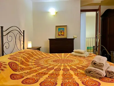 Letto o letti in una camera di Santa Maria Le Grazie House