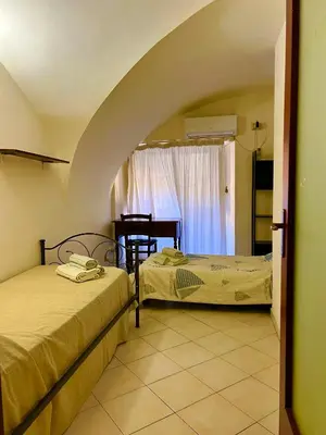 Letto o letti in una camera di Santa Maria Le Grazie House