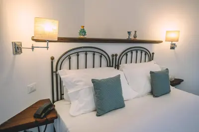 Letto o letti in una camera di Masseria Testaferrata