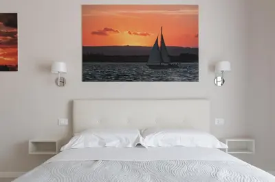 Letto o letti in una camera di PhotoRooms B&B