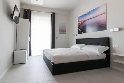 Letto o letti in una camera di PhotoRooms B&B