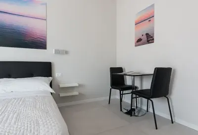 Letto o letti in una camera di PhotoRooms B&B