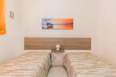 Letto o letti in una camera di Anna's house near the sandy beach and with wifi