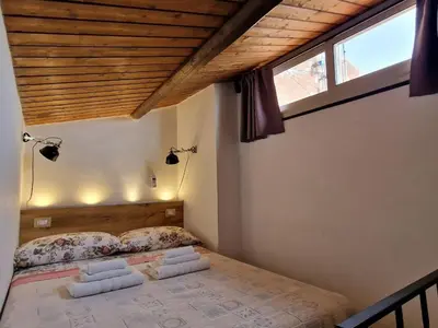 Letto o letti in una camera di siculi central apartment