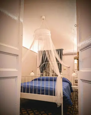 Letto o letti in una camera di siculi central apartment