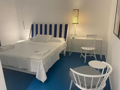Letto o letti in una camera di Near Ortigia