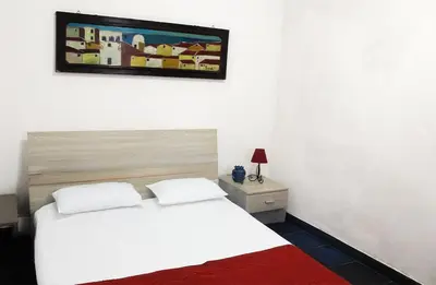 Letto o letti in una camera di Ortigia Palace