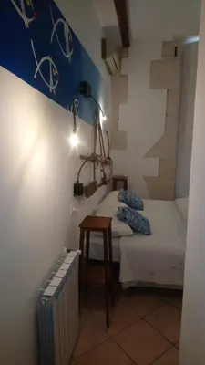 Letto o letti in una camera di L'Acanto