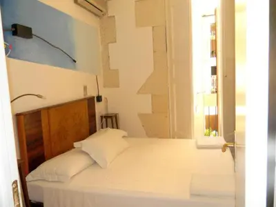 Letto o letti in una camera di L'Acanto