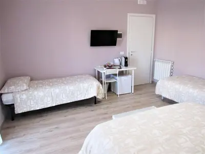 Letto o letti in una camera di B&B le camere di SALLY