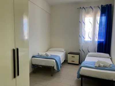 Letto o letti in una camera di Residence Fronte Mare