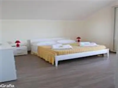 Letto o letti in una camera di Residence Fronte Mare