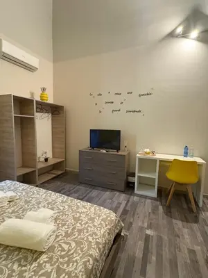 Letto o letti in una camera di Casa tua suites