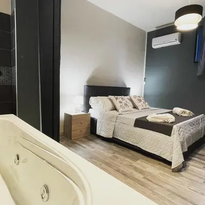 Letto o letti in una camera di Casa tua suites