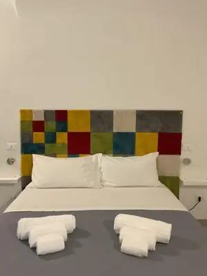 Letto o letti in una camera di Rossaroll Holiday Houses