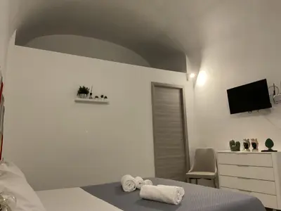 Letto o letti in una camera di Rossaroll Holiday Houses