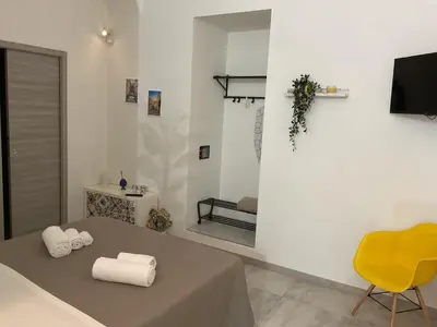 TV o dispositivi per l'intrattenimento presso Rossaroll Holiday Houses