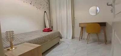 Letto o letti in una camera di The Good Place