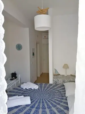 Letto o letti in una camera di Casa Mamà