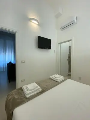 Letto o letti in una camera di Casa Amurusa