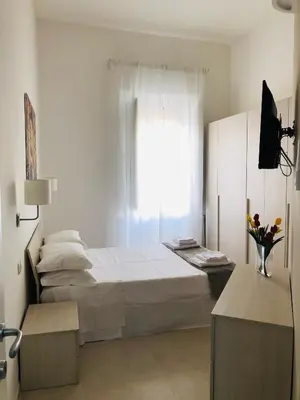 Letto o letti in una camera di Casa Amurusa