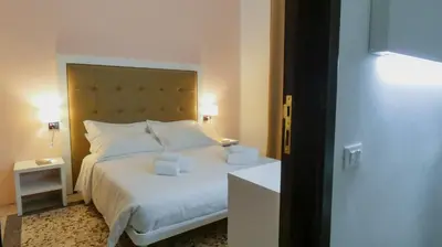 Letto o letti in una camera di Regina Margherita