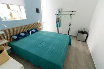 Letto o letti in una camera di Venti di Brucoli