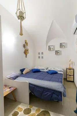 Letto o letti in una camera di Cocciu d’Amuri Home