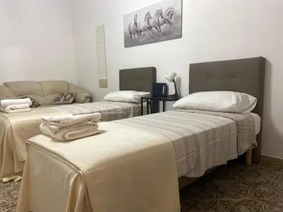 Letto o letti in una camera di Casa vacanza La Collegiata