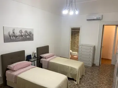 Letto o letti in una camera di Casa vacanza La Collegiata