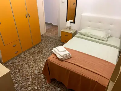 Letto o letti in una camera di Casa vacanza La Collegiata