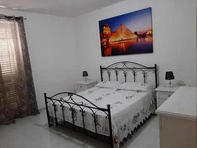 Letto o letti in una camera di Colle Alto Pachino - Marzamemi
