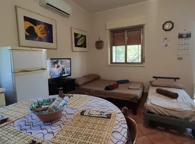 TV o dispositivi per l'intrattenimento presso Antonio's villa al mare con vista sull'Etna Vaccarizzo Catania