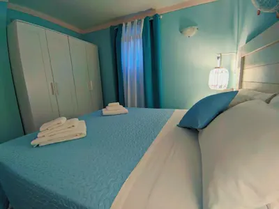 Letto o letti in una camera di Il Bounty - struttura per soggiorni brevi -