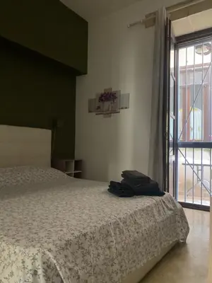 Letto o letti in una camera di casa vacanze Maniace 80