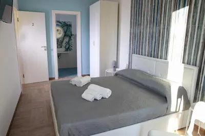 Letto o letti in una camera di Largo Sicilia B&B