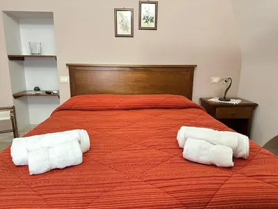 Letto o letti in una camera di Historic B&B Apartments Home