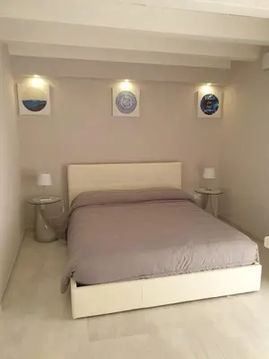 Letto o letti in una camera di Casa Bolle Ortigia