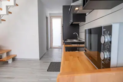 Cucina o angolo cottura di VJMAN House Sea Beach - SiciliaVacanza