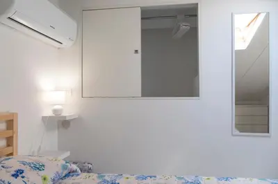 Letto o letti in una camera di VJMAN House Sea Beach - SiciliaVacanza