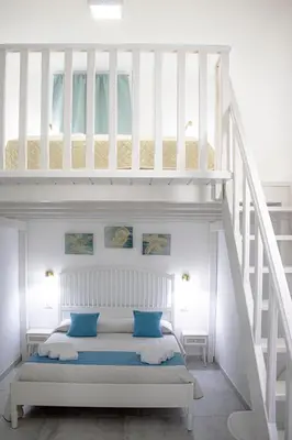 Letto o letti in una camera di I Gufi Bed & Breakfast Marzamemi