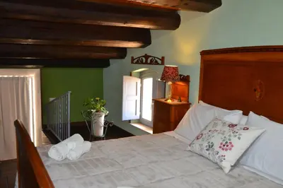 Letto o letti in una camera di SUD room Palazzo Rau della Ferla