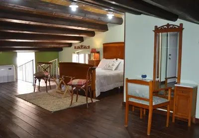 Letto o letti in una camera di SUD room Palazzo Rau della Ferla