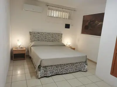 Letto o letti in una camera di Gray Pearl House